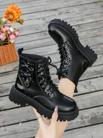 Step into edgy elegance with these British-inspired motorcycle boots that refuse to play it safe. Featuring a bold lace-up front, sturdy chunky heel, and a charming bow accent, they're the perfect blend of tough and feminine. Whether you're conquering city streets or embracing your rebellious side, these versatile boots deliver serious style in any season. Built for the bold, designed for the unforgettable.