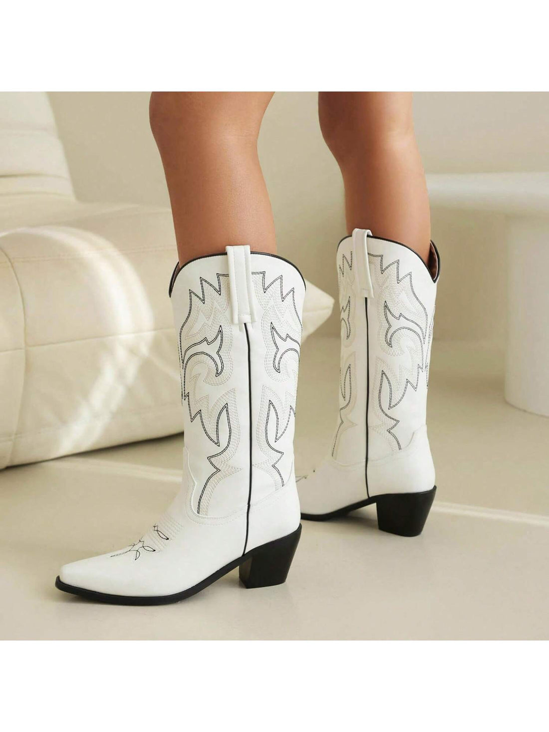 Elevate your western style with our Stylish Women's Embroidered Cowboy Boots. With a chunky heel and intricate embroidery, these boots add a touch of elegance to your western vibe. Step out in confidence and comfort with our perfect blend of fashion and function.