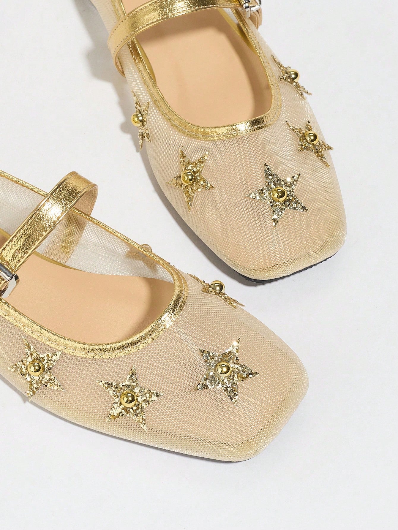 Keep your feet cool and stylish this summer with our Gold Mesh Ballet Flats. These breathable slip-ons feature a comfortable Mary Jane design, perfect for any summer outing. Dress them up or down, these flats are versatile and chic for any occasion.