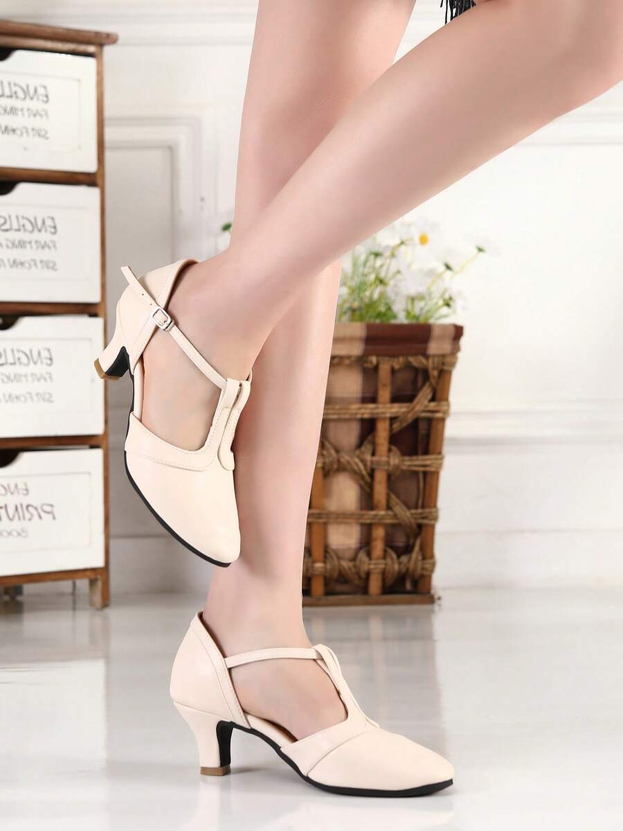 Elevate your dance floor presence with these stunning women's Latin dance shoes, expertly crafted for ballroom, salsa, tango, and beyond. Featuring a sophisticated beige colorblock design with eye-catching criss-cross detailing, these shoes combine vintage elegance with modern performance. The mid-height pyramid heel provides the perfect balance of support and style, while the durable PU leather upper and rubber outsole ensure lasting comfort through every spin and step. True-to-size fit with fabric lining 
