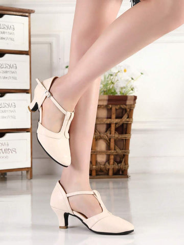 Elevate your dance floor presence with these stunning women's Latin dance shoes, expertly crafted for ballroom, salsa, tango, and beyond. Featuring a sophisticated beige colorblock design with eye-catching criss-cross detailing, these shoes combine vintage elegance with modern performance. The mid-height pyramid heel provides the perfect balance of support and style, while the durable PU leather upper and rubber outsole ensure lasting comfort through every spin and step. True-to-size fit with fabric lining 