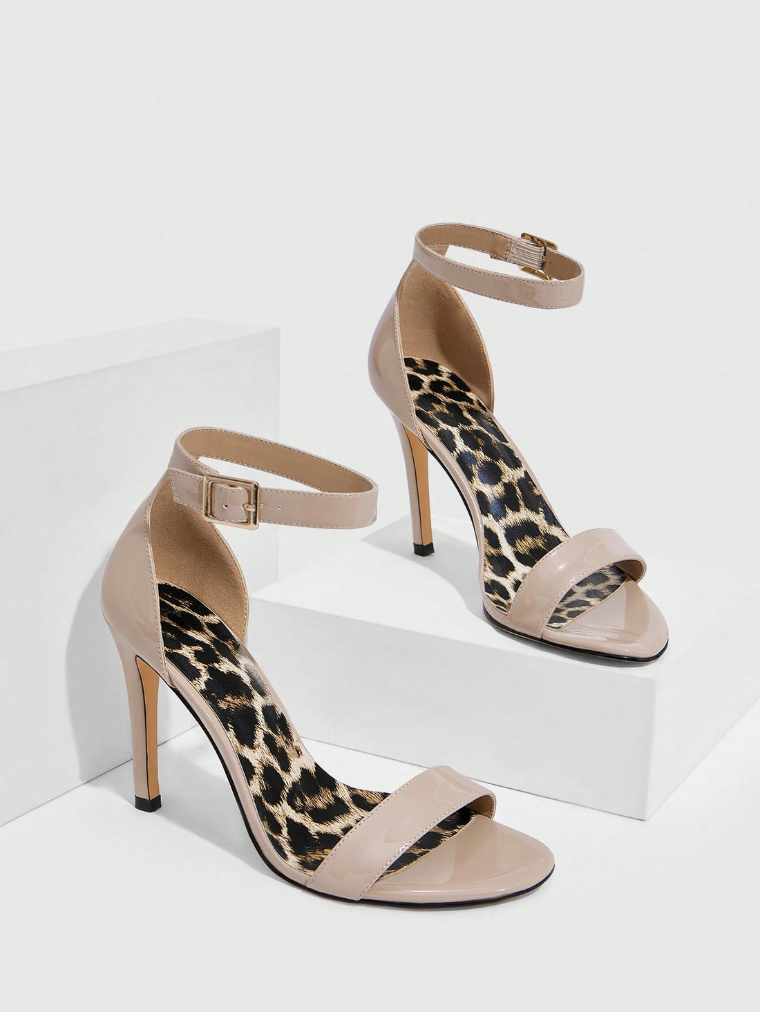 Unleash your wild side with these show-stopping leopard print high heel sandals! Featuring a sleek silhouette and adjustable buckle strap, they're the perfect blend of fierce and fabulous for any occasion. Whether you're heading to brunch, a night out, or just want to add some spotted sass to your everyday look, these heels deliver instant style points. The secure buckle keeps you comfortable all day long, while the bold leopard pattern ensures you'll turn heads wherever you go. Step into confidence and let