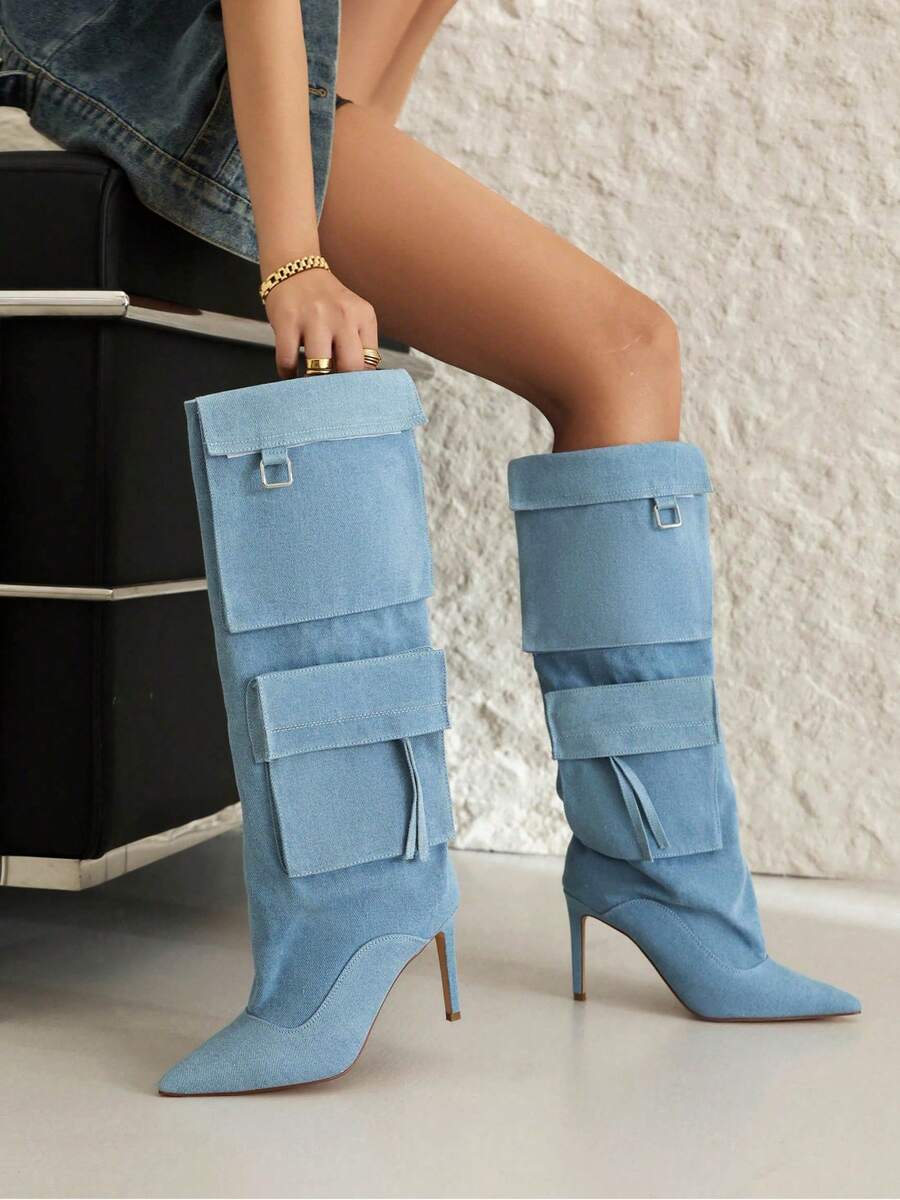 Step into spring and summer with serious style in these knee-high denim cowboy boots. Crafted from classic denim fabric, they feature a sturdy chunky mid heel that keeps you comfortable all day long. The timeless cowboy silhouette pairs perfectly with everything from sundresses to denim shorts, giving you that effortless Western-inspired vibe. Whether you're heading to a music festival, casual brunch, or just want to add some personality to your everyday look, these boots deliver attitude and charm in one f