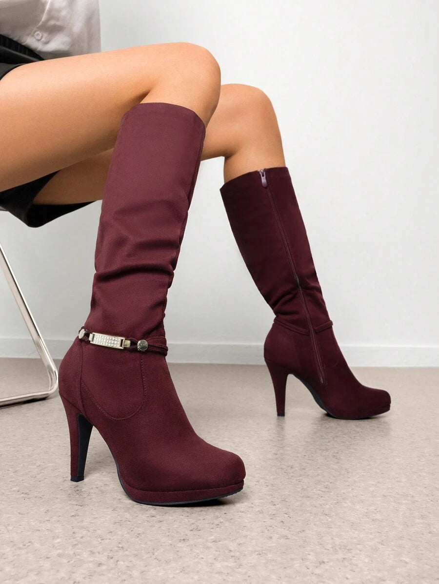 Step into autumn with serious style in these knee-high platform heel boots! Designed to elevate your fall wardrobe (literally), these beauties feature a sleek silhouette that pairs perfectly with everything from cozy sweaters to chic dresses. The sturdy platform sole keeps you comfortable while the statement heel adds that extra dose of confidence to your stride. Whether you're heading to brunch or a night out, these boots are your new go-to for turning heads and owning every season.