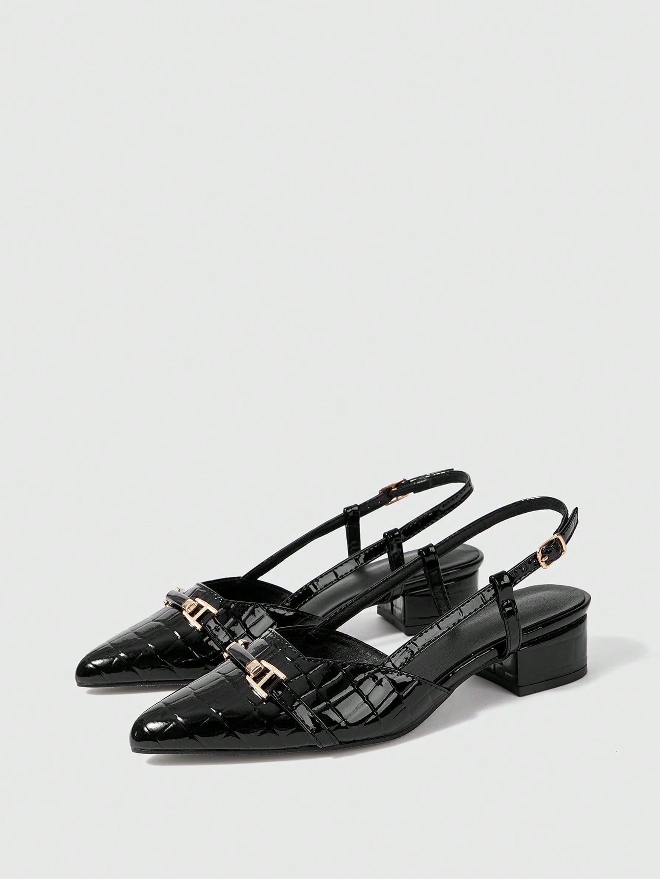 Step into sophistication with these stunning pointed-toe pumps that demand attention. The sleek silhouette elongates your legs while the eye-catching metal buckle accent adds just the right amount of edge and glamour. Perfect for elevating your everyday look or turning heads at special occasions, these high heels deliver confidence with every stride. Whether you're conquering the boardroom or the dance floor, these versatile pumps are your secret weapon for looking absolutely fabulous.
