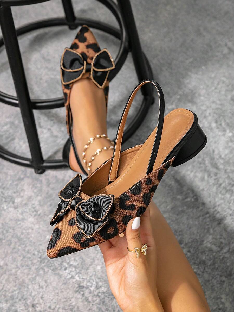 Step out in style with these playful pointed toe mules featuring a chic metal heel. Slip them on easily with their backless, open-toe design, perfect for adding a flirty touch to any outfit. These loafers blend comfort and flair, making every step a confident statement.