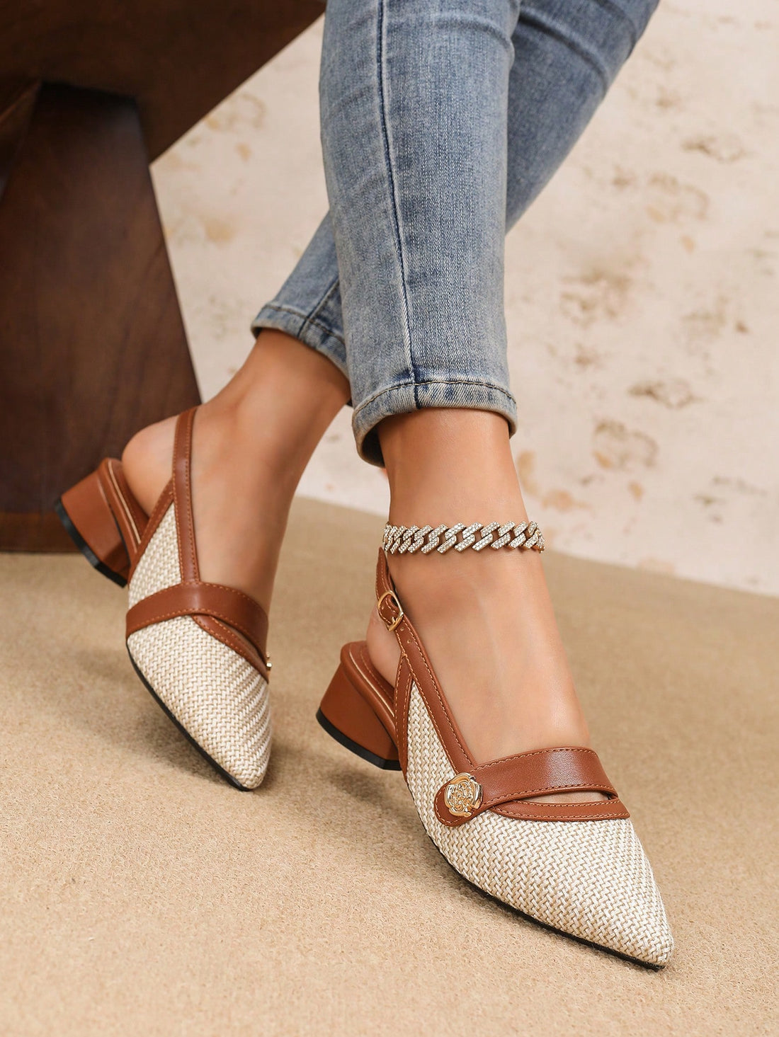 Treat your feet to some style with our Stylish Women's Pointed Toe Slip-On Mules! These trendy shoes feature a heart-shaped metallic buckle, adding a touch of love to your look. Easy to slip on, these mules also provide a pointed toe for a sleek and chic appearance. Step out in style today!