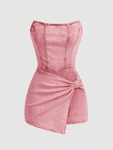 Washed pink strapless denim romper front with corset seams and wrap overlay