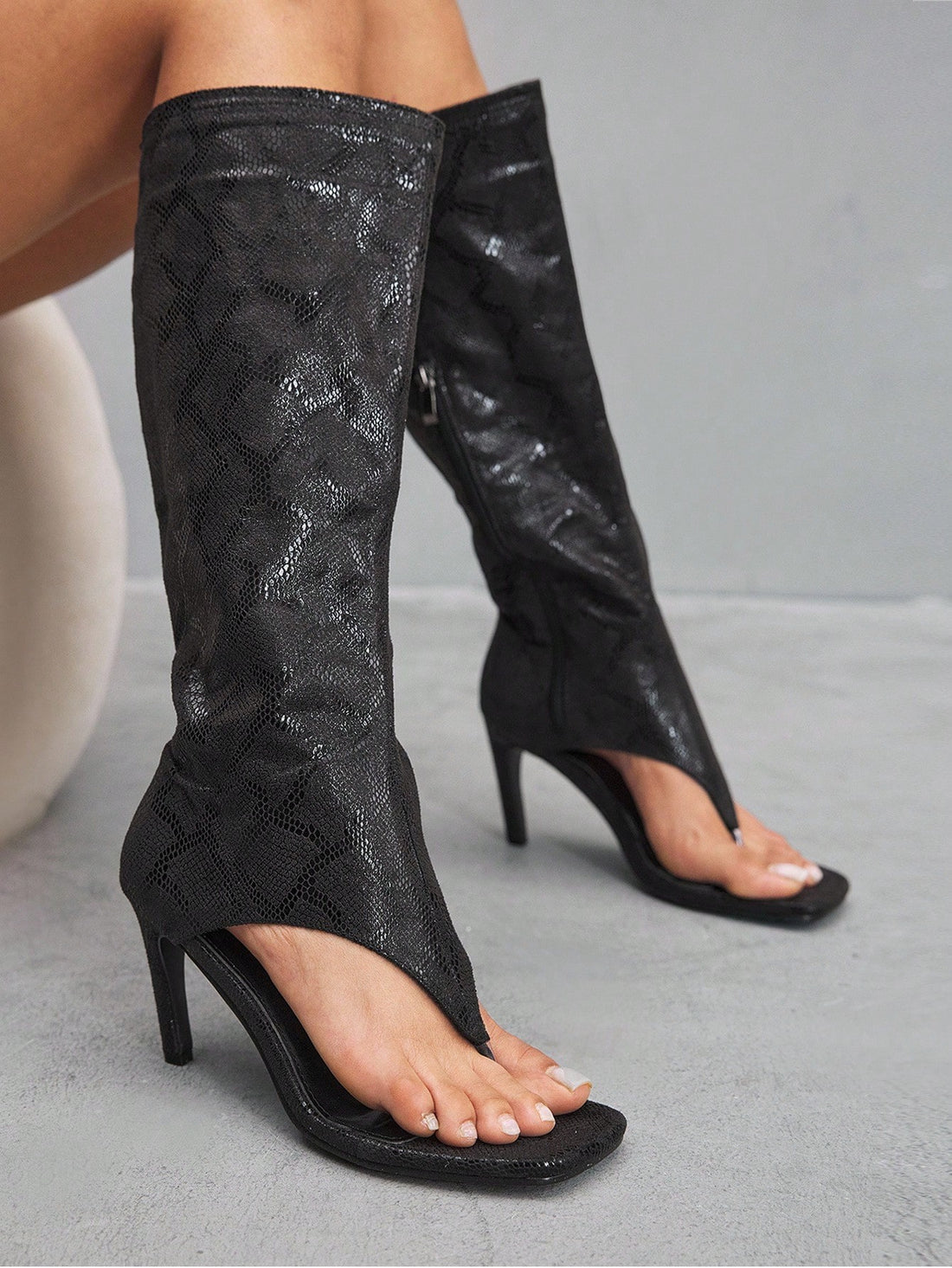 Step into sophistication with these show-stopping tall boots that command attention from every angle. Featuring a chic square toe and sleek slim heel, they're designed for anyone who refuses to blend into the background. Whether you're heading to the office, a night out, or anywhere in between, these boots deliver that perfect blend of edge and elegance. The structured silhouette flatters your legs while the elevated heel adds instant confidence to your stride. Make a bold statement—because ordinary just is