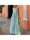 Embrace sunny days in this playful striped long beach dress designed just for you. Featuring breezy sleeveless spaghetti straps and a handy front pocket, it’s your go-to for effortless summer style and convenience. Perfect for beach strolls or casual outings, this dress keeps you cool and chic all day long.