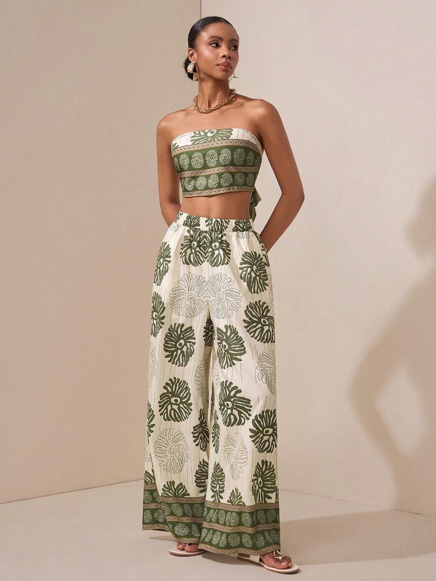 Turn heads at your next summer event in this charming two-piece set that effortlessly blends style and comfort. The elegant floral print top pairs perfectly with sleek straight-leg pants featuring practical pockets—because looking fabulous shouldn't mean sacrificing functionality. Whether you're dancing at a festival, celebrating at a wedding, or grabbing coffee with friends, this versatile ensemble keeps you feeling confident and chic. Dress it up with heels or down with sneakers for endless outfit possibi