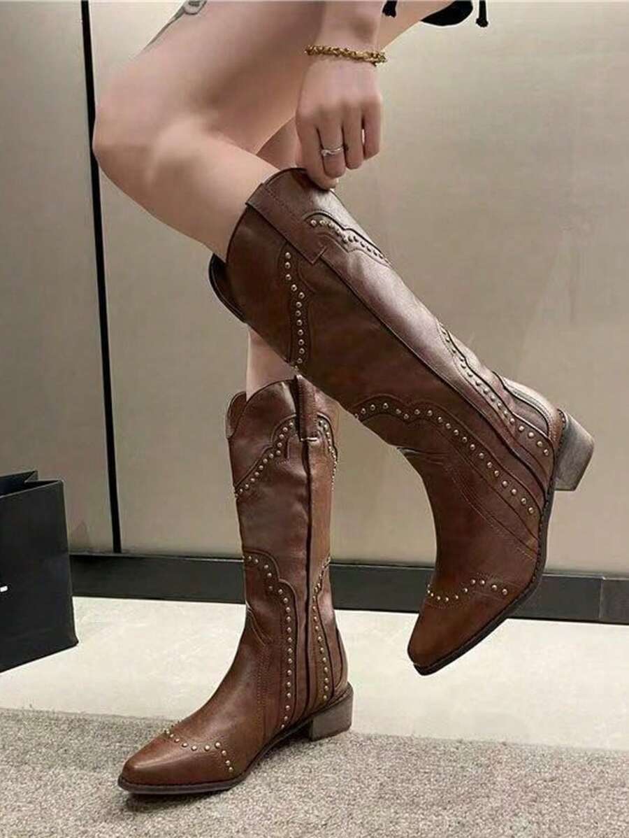 Step into sass with these stylish women's western mid-calf boots! Featuring a trendy V-cut and eye-catching rivet details, they add a bold touch to any outfit. The chunky heel gives you just the right lift for dancing through the day or night with confidence and comfort. Perfect for adding a playful western flair to your wardrobe!