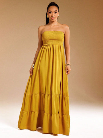 Brighten your summer days with this playful yellow tiered maxi dress. Featuring a strapless smocked bodice, it offers a comfy fit that moves with you. The flowing tiers add a breezy, effortless vibe perfect for sunny outings or beachside strolls. Embrace easy elegance and let your style shine!