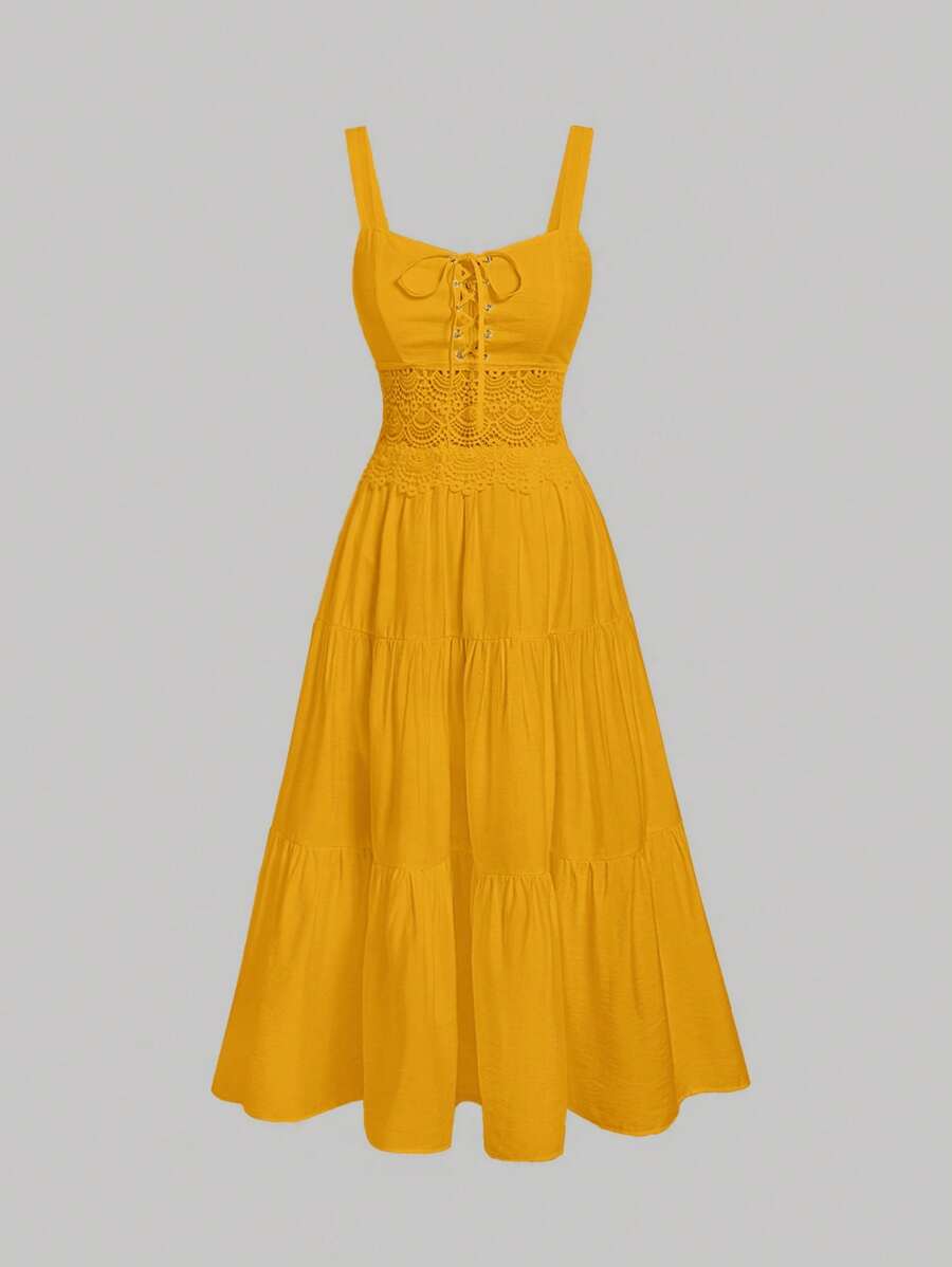 Elevate your summer wardrobe with this charming cami dress that's equal parts flirty and fabulous. The delicate lace-up detail adds an unexpected twist, while the playful ruffle hem keeps things fun and feminine. Perfect for casual outings, beach days, or those moments when you want to feel effortlessly put-together. Slip it on and let your style do the talking—this dress is your new go-to for warm-weather confidence.