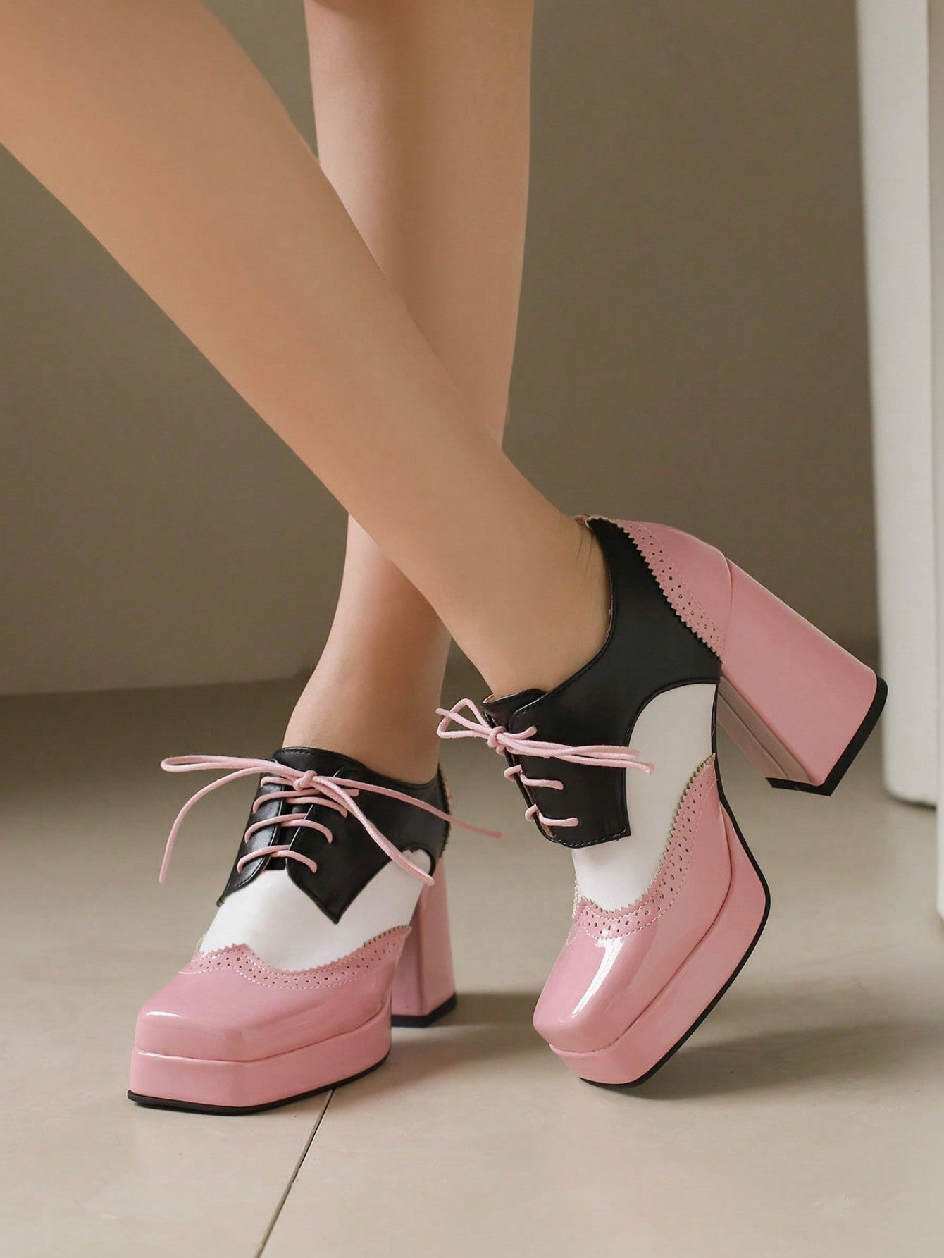 Elevate your holiday style with our Sultry Lace-Up Brogue Mary Jane Heels. With their sophisticated lace-up design and classic brogue detailing, these heels add a touch of vintage charm to any outfit. Perfect for a stylish Christmas, step into these heels and make a statement at any holiday event.