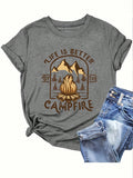 Unleash your inner campfire queen with our 'Life is Better by the Campfire' graphic tee! Perfect for summer nights spent roasting marshmallows and sharing laughs, this tee will show off your love for the great outdoors. Made for comfort and style, it's a must-have for any summer adventure.