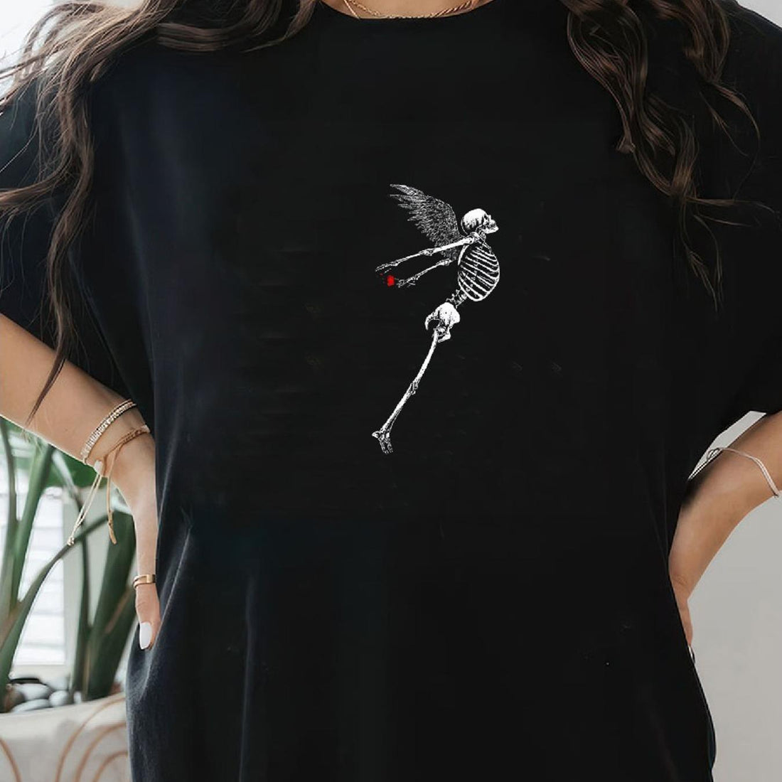 Elevate your summer wardrobe with this chic knit tee! Featuring a bold skeleton graphic, this tee adds a touch of edginess to any outfit. Made with high-quality materials and designed for comfort, this tee is the perfect balance of style and functionality. Wear it with jeans for a casual look or dress it up with a skirt for a night out.