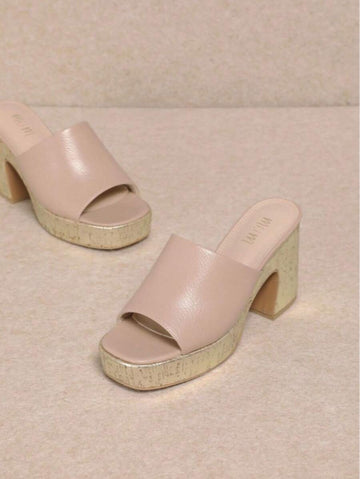 Step into summer with these playful platform chunky heel slip-on sandals designed for stylish comfort. Their bold, elevated sole adds a fun pop to any outfit while providing all-day support. Perfect for beach days or city strolls, these sandals make it easy to stay cool and look fabulous without sacrificing comfort. Ready, set, summer!