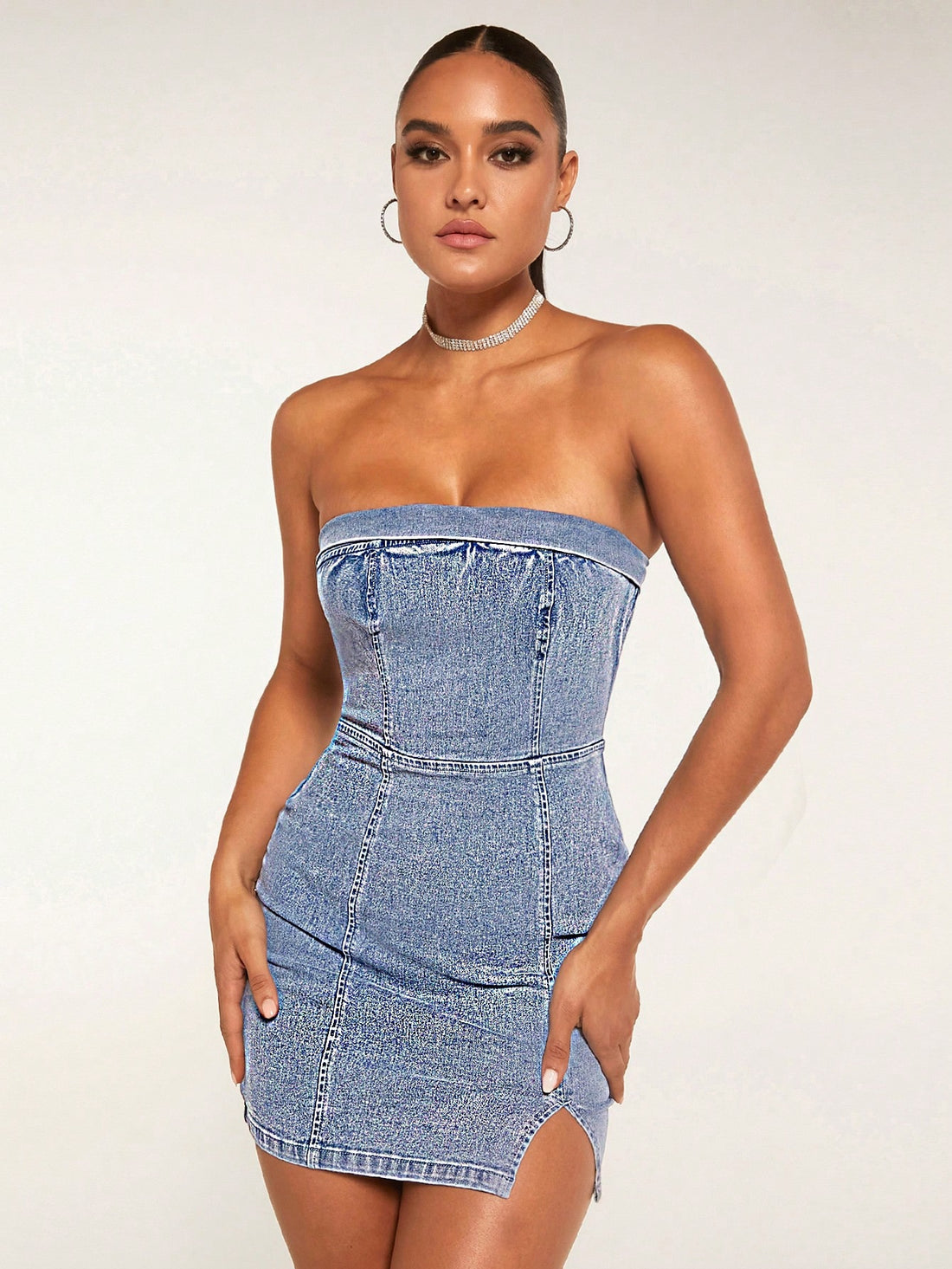 Stay cool and stylish this summer with our Summer Chic Strapless Denim Dress. The split hem design and strapless neckline make it perfect for warm weather, while the denim fabric adds a touch of casual elegance. Perfect for any occasion, this dress is a wardrobe must-have.