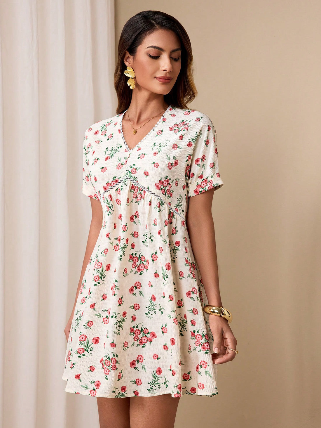 Effortlessly chic in our Summer Chic Mini Dress, featuring a playful floral print and a flattering v-neck design. Perfect for those hot summer days, achieve that effortless style with ease. Stay cool and stylish all season long. (Warning: may cause envious stares!)