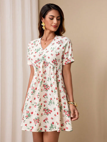 Effortlessly chic in our Summer Chic Mini Dress, featuring a playful floral print and a flattering v-neck design. Perfect for those hot summer days, achieve that effortless style with ease. Stay cool and stylish all season long. (Warning: may cause envious stares!)
