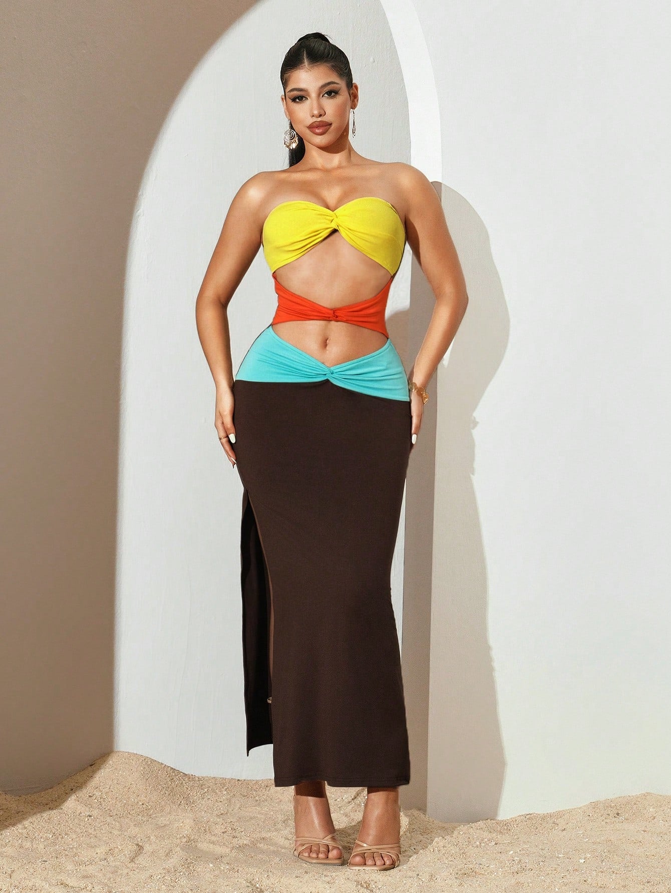 Turn heads this season in our Summer Colorblock Twist Hollow Out Bodycon Dress—the ultimate warm-weather essential for those who love bold style. Featuring eye-catching color blocking and strategic cutouts, this figure-hugging silhouette flatters every curve while keeping you cool and comfortable. The twisted details add an unexpected twist of sophistication to this flirty piece. Perfect for date nights, beach parties, or anywhere you want to make a statement. Slip it on and let your confidence shine as bri