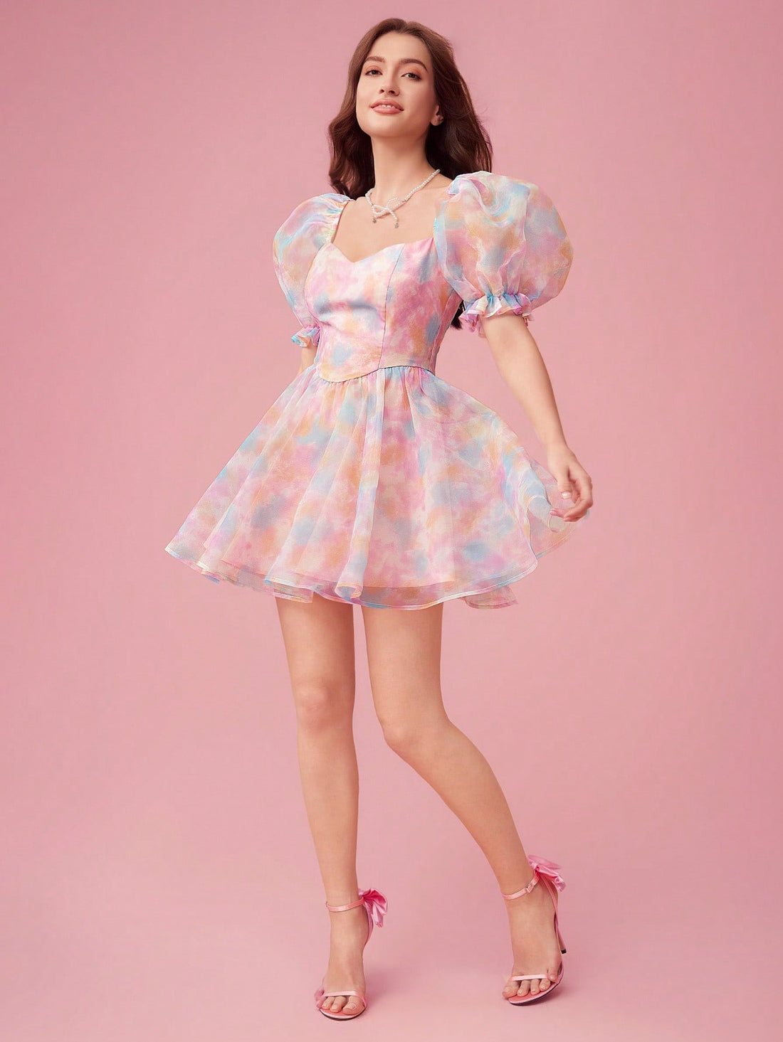 Indulge in a Summer Romance with this playful dress! The sweetheart neckline and bubble sleeves add sweet charm while the tie-dye print adds a touch of whimsy. Perfect for sunny days and fun nights with its lightweight fabric and flattering fit. Time to make some sweet memories!