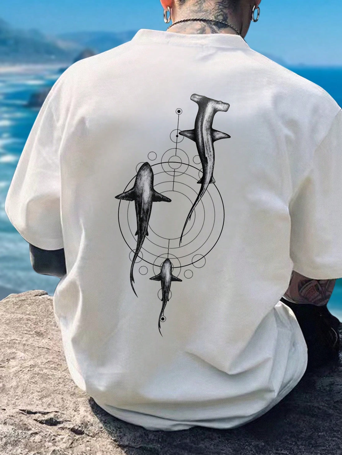 Elevate your summer wardrobe with our Men's Shark Printed Casual Short Sleeve T-Shirt. Perfect for a casual day out, this shirt features a bold shark print that adds a playful touch to your look. Made with lightweight fabric, it will keep you cool and comfortable in warmer weather. Stay stylish and comfortable all season long with our Summer Style Statement T-Shirt.