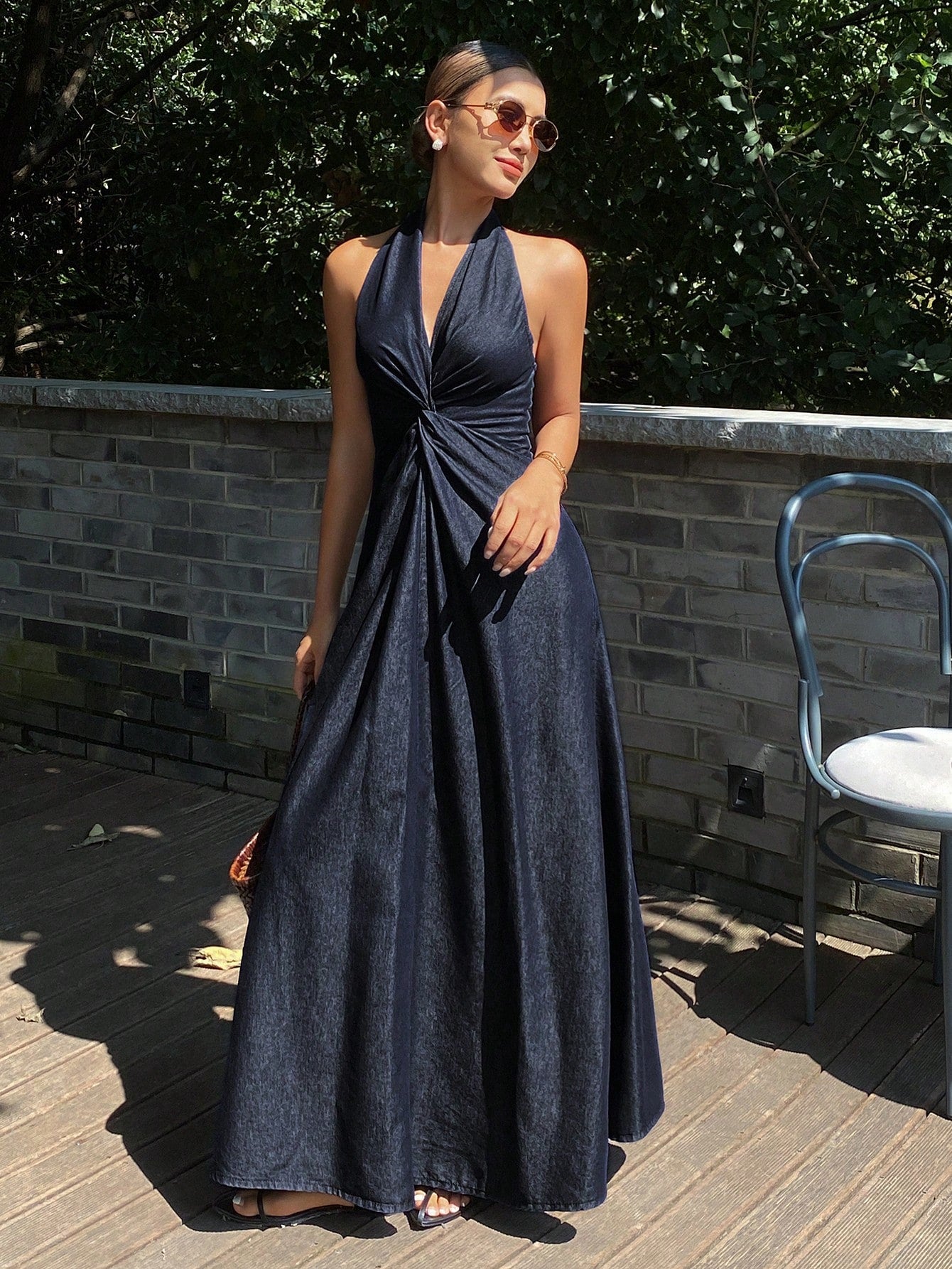 Elevate your warm-weather wardrobe with this versatile denim dress, designed for effortless style and comfort. The flattering V-neckline and halter straps create a sophisticated silhouette, while the cinched waist defines your figure beautifully. Crafted from quality denim, this long-length piece transitions seamlessly from casual daytime outings to evening gatherings. Perfect for layering or wearing solo, it pairs well with sneakers, sandals, or heels depending on the occasion. An essential addition for an