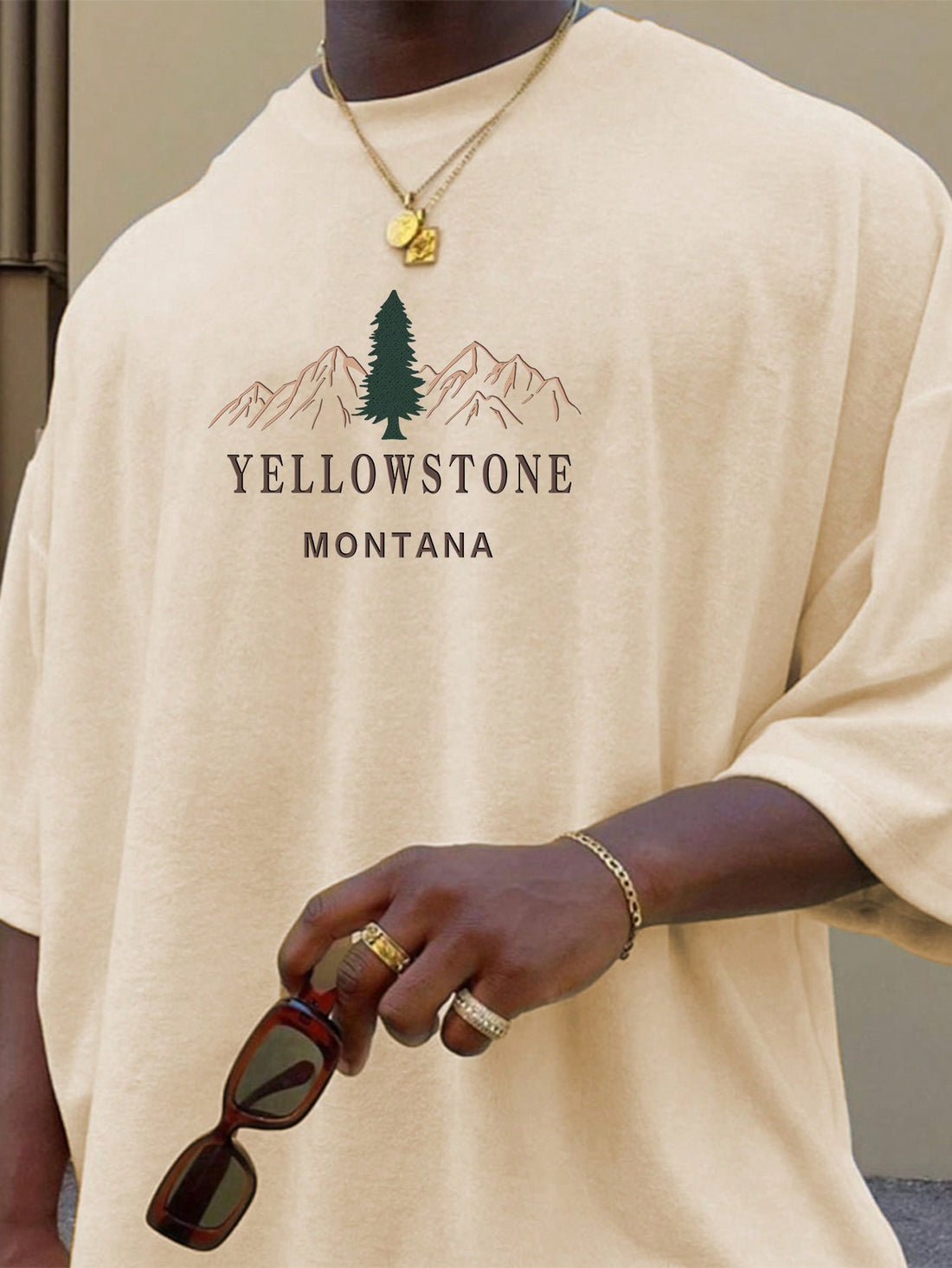 Show off your summer vibes with this eye-catching yellow stone printed t-shirt for men. Made with high-quality materials, it combines style and comfort for the ultimate summer look. Perfect for any casual occasion, this round neck t-shirt is a must-have addition to your wardrobe.