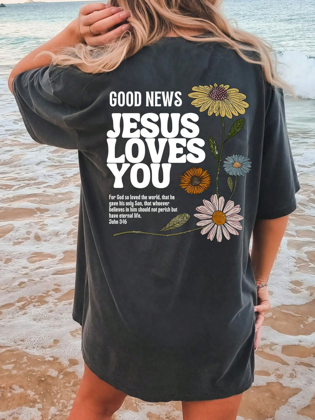 Welcome to the summer season with our Summer Vibes: Oversized Floral Slogan T-Shirt! This trendy t-shirt features a beautiful floral design and a powerful message that reads 'Good News: Jesus Loves You'. Stay comfortable and stylish while spreading positivity and love with this oversized t-shirt. Get yours today!