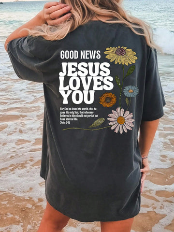Welcome to the summer season with our Summer Vibes: Oversized Floral Slogan T-Shirt! This trendy t-shirt features a beautiful floral design and a powerful message that reads 'Good News: Jesus Loves You'. Stay comfortable and stylish while spreading positivity and love with this oversized t-shirt. Get yours today!