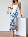 Get ready for some serious summer vibes with our Strappy Tropical Print Maxi Dress in Blue & White. Made with lightweight fabric, this dress is perfect for those hot summer days. The strappy design adds a touch of elegance, while the tropical print screams vacation mode. Stay cool and stylish this season with our Summer Vibes dress.