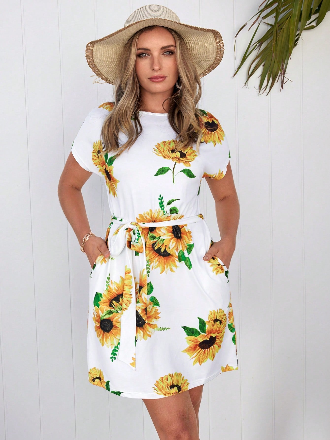 Get ready to brighten up your wardrobe with the Sunny Delight dress! Featuring a fun sunflower print and a flattering belted waist, this dress is sure to turn heads. Plus, the conveniently placed slant pockets make it both stylish and practical. Embrace the sunshine with this must-have dress!