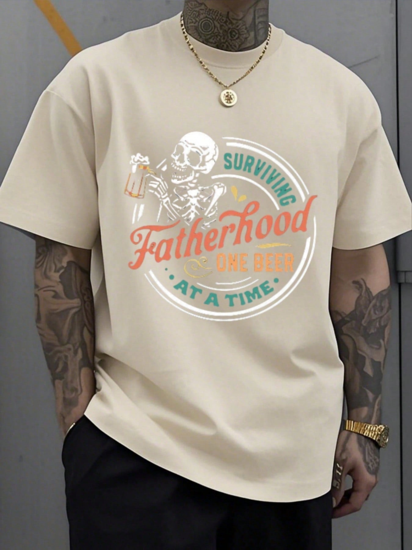 Dads, show off your survival skills with our Surviving Fatherhood Athletic T-Shirt. Made with heavyweight cotton, this tee features a skeleton design holding a beer mug, adding a touch of humor to your everyday look. Perfect for all your dad adventures. Cheers!