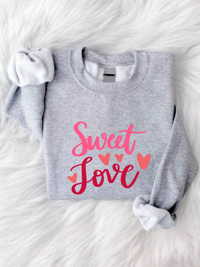 Show your love for sweat and all things cozy with this Valentine's Day sweatshirt. Perfect for lounging with your loved one (or loving yourself), this sweatshirt is sure to keep you warm and stylish on the most romantic day of the year. (Sweat not included.)