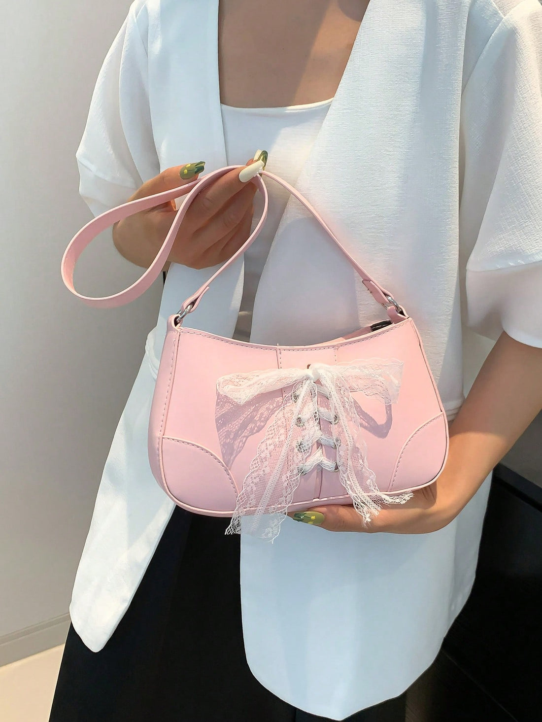 Introducing the Sweet Bowknot Handbag, a unique lace shoulder bag perfect for fashionable girls. With its charming bowknot design and delicate lace material, this handbag is sure to make a statement. Stay stylish while carrying all your essentials with ease.