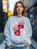 Show some love this Valentine's Day with our Sweet Heartbeat sweatshirt. A playful cartoon love print adorns this cozy pullover, making it the perfect gift for that special someone. Stylish and fun, this sweatshirt will keep you warm and stylish on the most romantic day of the year. (