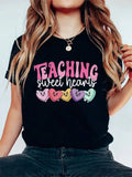 Show your appreciation for the educators in your life with our Sweet Hearts Teacher T-Shirt. This playful shirt makes for the perfect Valentine's Day gift and is sure to bring a smile to any teacher's face. Let them know they're loved and valued with this quirky and fun t-shirt.