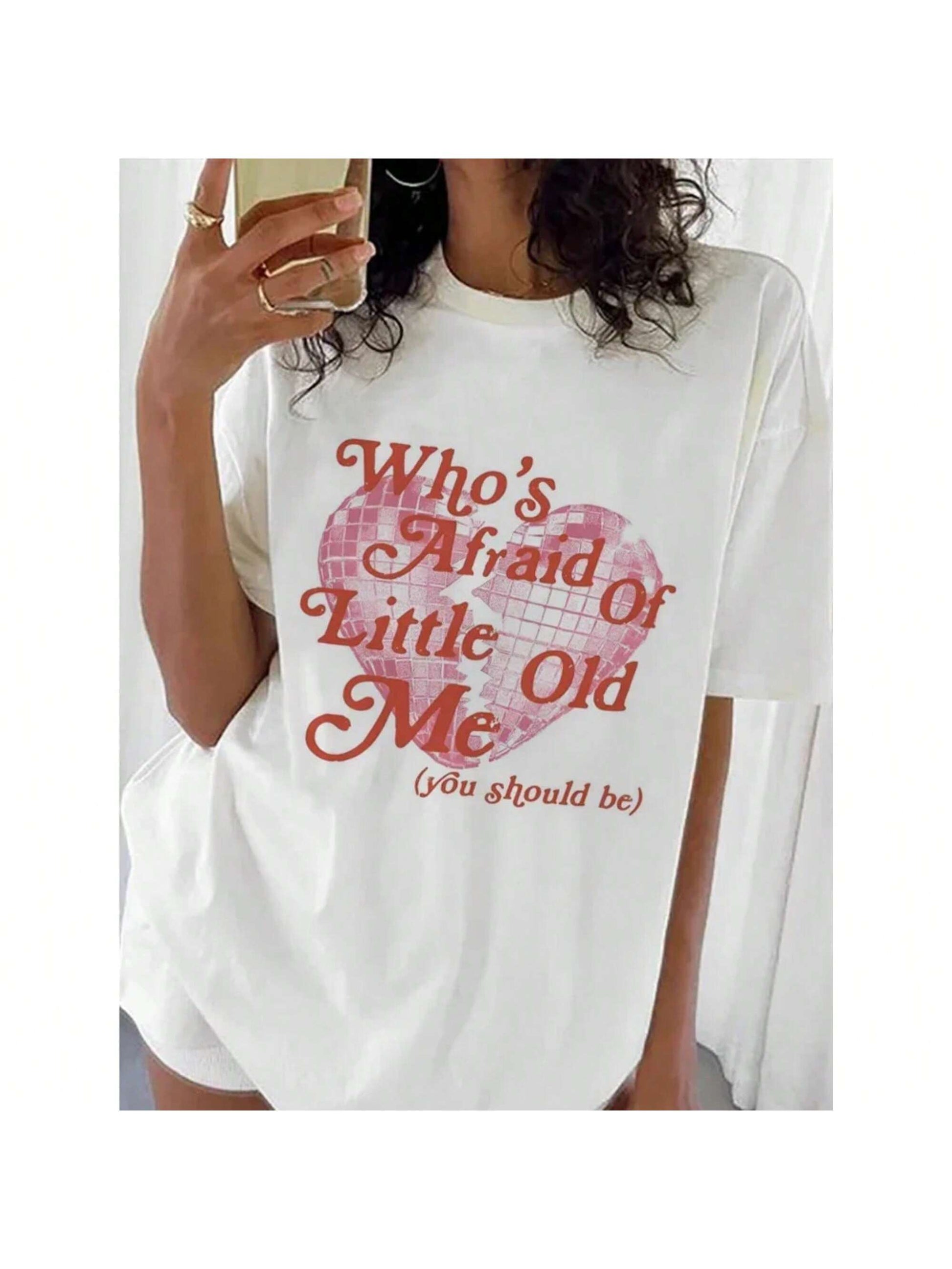 Make a statement with our Sweet and Sassy Heart Print T-Shirt! Who needs boring when you can have fun? This shirt is perfect for those who aren't afraid to let their fun-loving, quirky side shine through. So go ahead and embrace your uniqueness with this playful and stylish shirt.