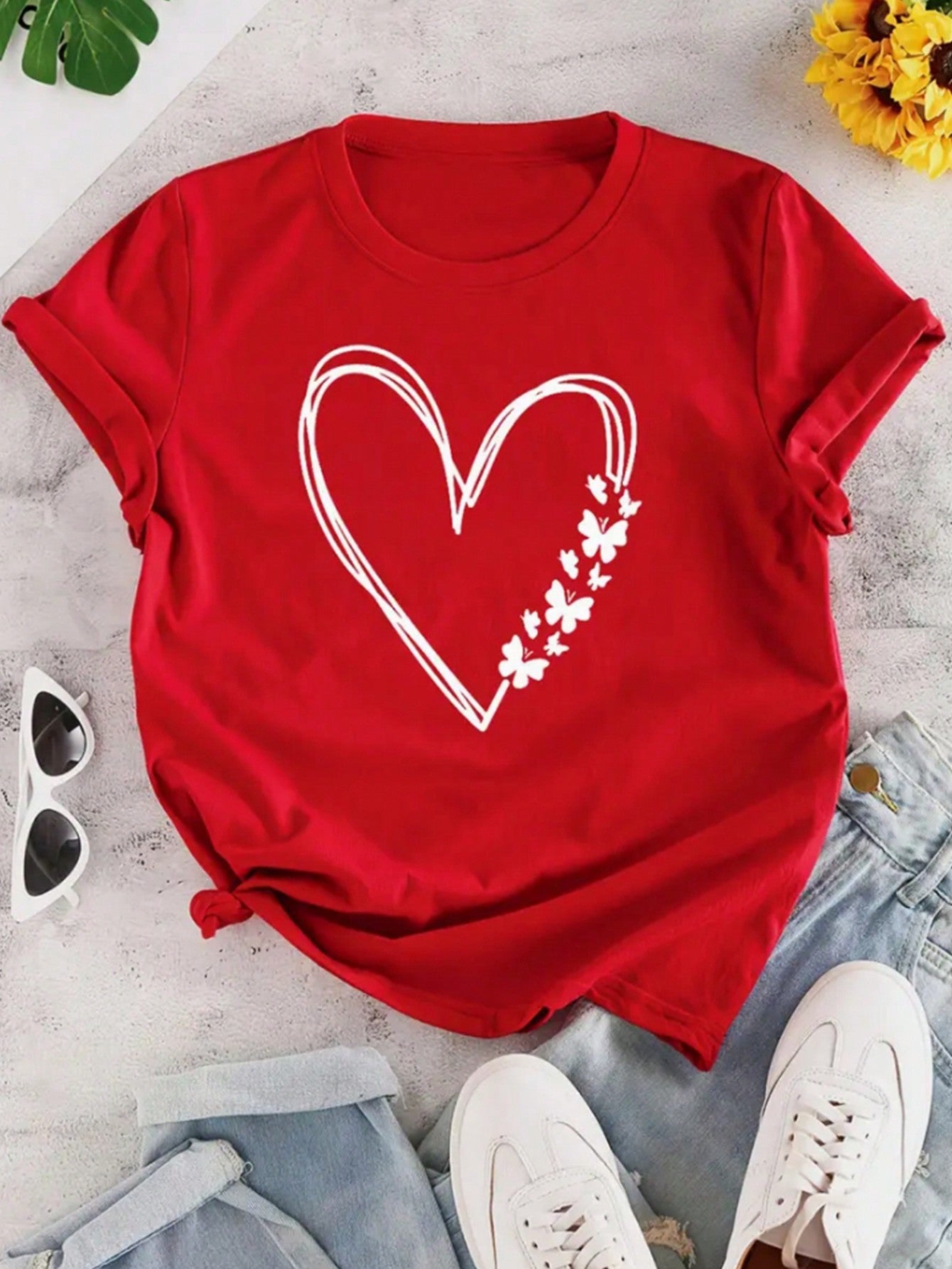 Get ready to show some love with this Sweetheart Style: Valentine's Day Heart Print Graphic Tee. Stand out in style with this cute and quirky graphic tee, perfect for celebrating the holiday of love. Spread some cheer and wear your heart on your sleeve (quite literally) with this must-have shirt.