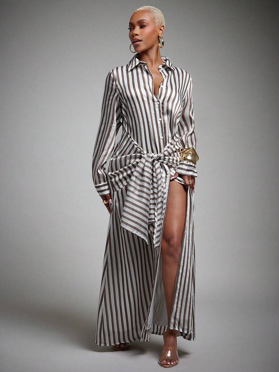 Front view of brown and white striped maxi shirt dress with point collar, waist sash, and high side slit