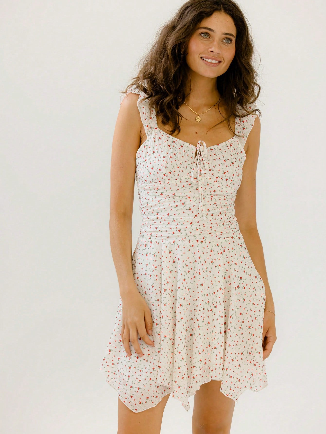 Get ready to turn heads in this Textured Floral Tie-Front Mini Sundress! With its playful tie-front detail and vibrant floral texture, it’s your go-to for sunny vacations or lively parties. Flirty and fun, this mini dress moves with you, making every step feel like a celebration. Perfect for sunny days and warm nights, it’s the effortless outfit for endless summer vibes.