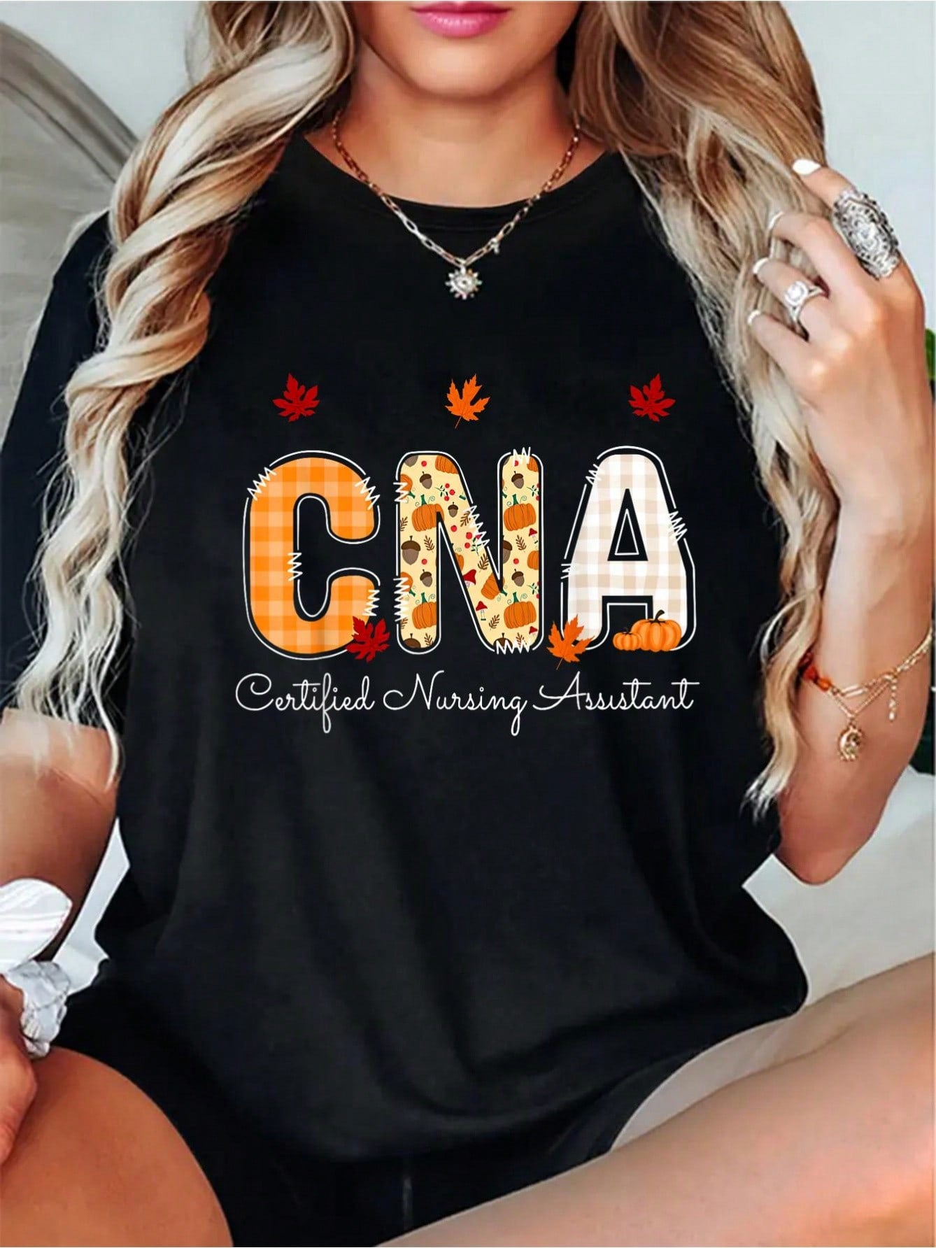 Show off your thankfulness with this quirky and playful t-shirt for certified nursing assistants! The fall leaves design adds a touch of seasonal charm, making it the perfect addition to your Thanksgiving wardrobe. Get ready to spread some joy and appreciation in this unique and fun t-shirt!