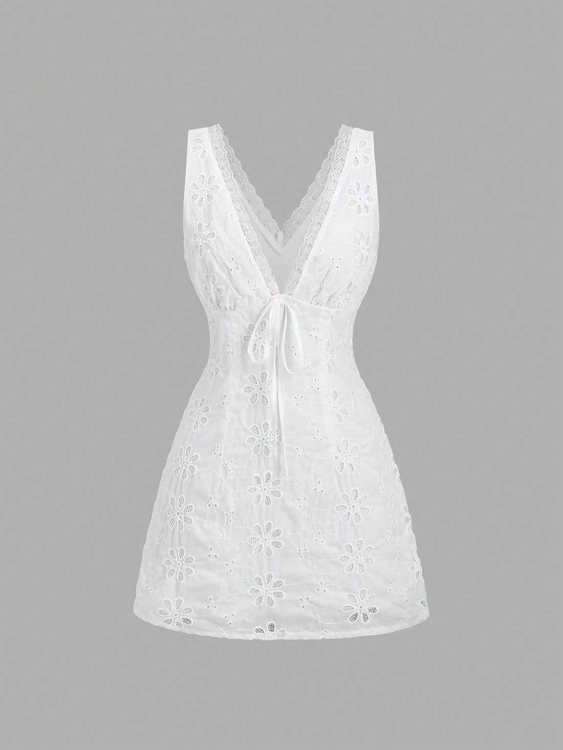 Step into charm with the Graceful Embroidered Mini Dress! Featuring a flirty V-neck, delicate lace trim, and slender spaghetti straps, this dress effortlessly blends sweet and sassy. Perfect for twirling through sunny days or dancing into the night, it’s your go-to for a playful yet elegant look that turns heads wherever you go.