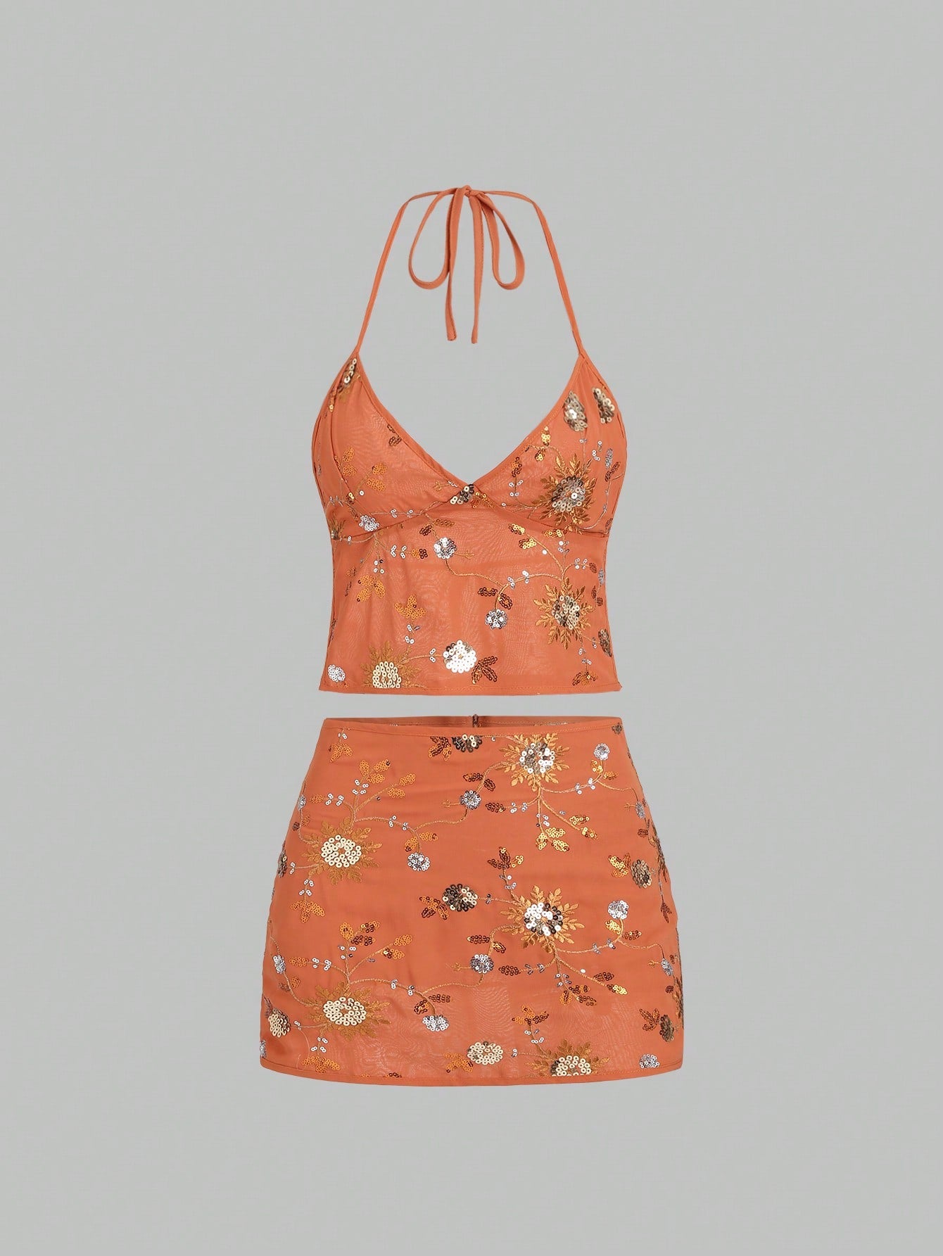 Turn heads effortlessly with the Modern Mirage Set! Featuring a flirty V-neck and a backless beaded halter, this duo brings sparkle and sass to your look. The low-rise skirt adds a touch of daring charm, creating a silhouette that’s both bold and beautiful. Perfect for nights when you want to shine and dance the evening away!
