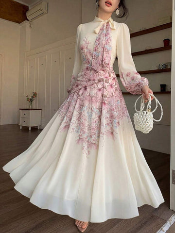 Ivory floral maxi dress with high tie neckline and long puff sleeves