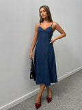 Elevate your style with our Timeless Denim Charm: Sleeveless Midi Dress. This effortlessly elegant dress exudes charm and sophistication, while providing the comfort of denim. Perfect for any occasion, it's a must-have addition to your wardrobe.