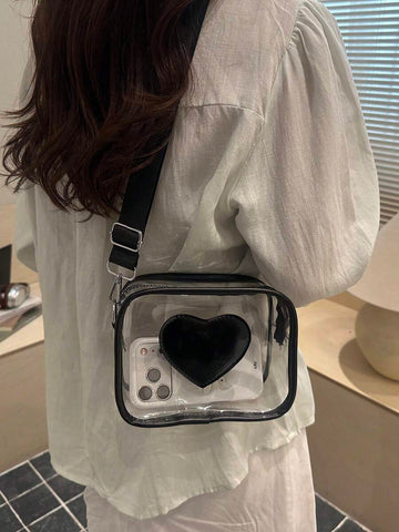 Transparent PVC rectangular crossbody bag with black trim black heart front patch zipper top and adjustable black strap