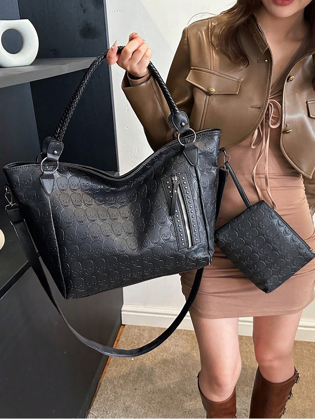 Make a statement with this chic 2-piece tote bag set that's as versatile as your lifestyle. Crafted from sleek black PU leather and adorned with edgy metal studs, this duo delivers serious style for any occasion—whether you're heading to the office, meeting up with friends, or hunting for the perfect gift. The spacious main tote handles everyday essentials with ease, while the compact companion bag keeps your smaller items organized and accessible. Durable, eye-catching, and endlessly practical, this set pr